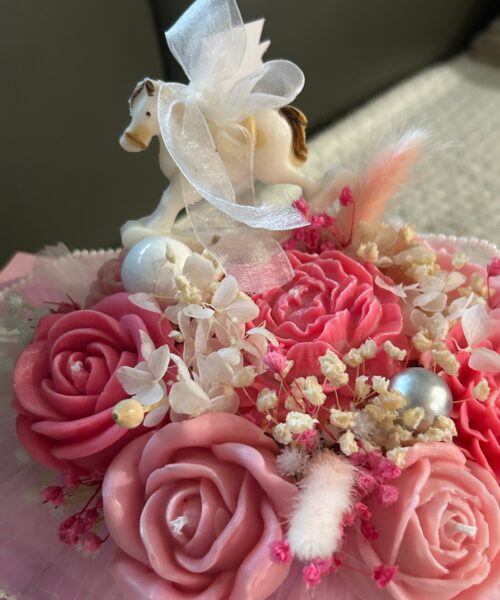 A Gift from the Heart Elevate your gifting game with a bouquet that captures the essence of love and the beauty of nature. Our Heart-Shaped Floral Bouquet Candle is a stunning fusion of sculpture and scent. Intricately molded with a cluster of delicate blossoms into a perfect heart silhouette, this 9-inch tall masterpiece serves as a breathtaking centerpiece for any romantic occasion. Signature Scent Profile Experience a layered floral journey designed to soothe and uplift: Top Notes: Sweet Tangerine & Tea Heart Notes: British Rose, Jasmine, and Tuberose Base Notes: Soothing Lavender Product Highlights Height: 9 Inches Wax: 100% Hand-poured soy wax for a clean, non-toxic, and eco-friendly burn. Burn Time: Up to 36 hours of room-filling fragrance. Artisanal Craftsmanship: Every petal is uniquely detailed, ensuring your heart-shaped bouquet is a one-of-a-kind work of art. Care & Safety Instructions To keep your Mausam Art creation looking its best: The Perfect Base: Due to its unique shape, this candle is designed to drip artistically as it melts. Always place it on a heat-resistant, rimmed tray (glass or wood) to protect your surfaces. Wick Maintenance: Trim the wick to 1/4 inch before every light. This prevents soot and ensures an even, beautiful glow. The Heart-Shaped Floral Bouquet Candle